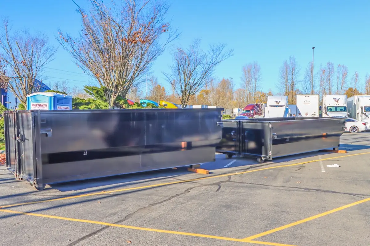 Professional dumpster rental service with roll-off container on residential driveway in Mamakating